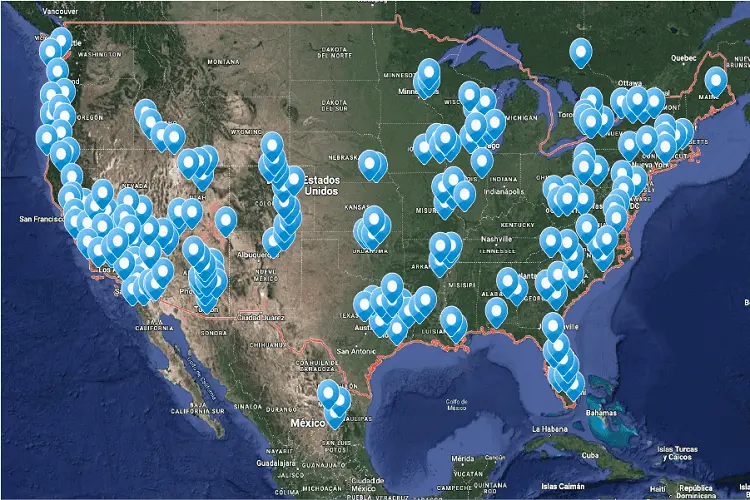 Map of the continental United States with numerous blue map markers indicating various locations across the country, as well as in parts of Mexico and Canada.